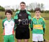 Referee and Team captains Geoffrey oG Laverty (St Brendans) and Kevin Small (Creggan)