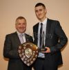  Willie Irwin receives the Hugo McKeegan Shield for the Most Improved Senior Player from Guest of Honour Denis Rackard Coady 