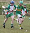 Leo Morgan (St Brendans) clears the ball away from Kealan McCann (Creggan)