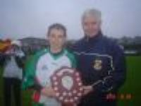 North Antrim Chairman presents the u16A shield to captain Donal O'Hara