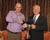 Dominic Mc Quillan presents Bernie Williamson with the John Wilson Trophy Merit Award
