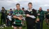 Liam Hamilton Captain of the Junior Feis Winning Team presented with Cup by Owen Elliot