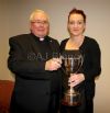 Tara Mc Hugh-Logan receives the John Wilson Trophy from Canon Alex Mc Mullan